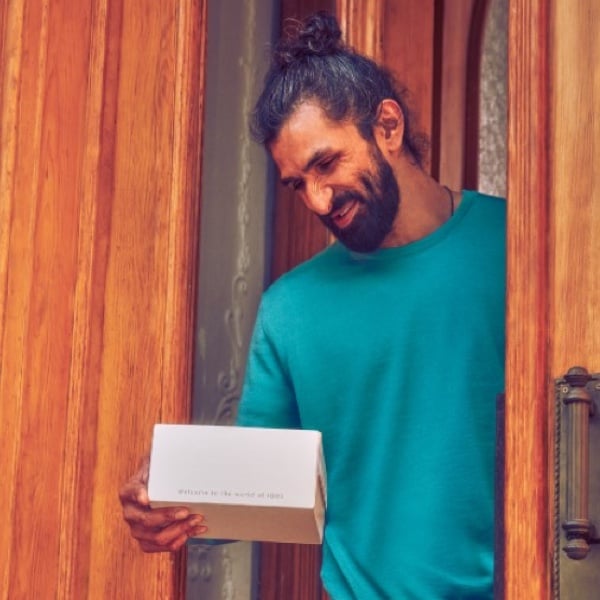A man with an IQOS box.