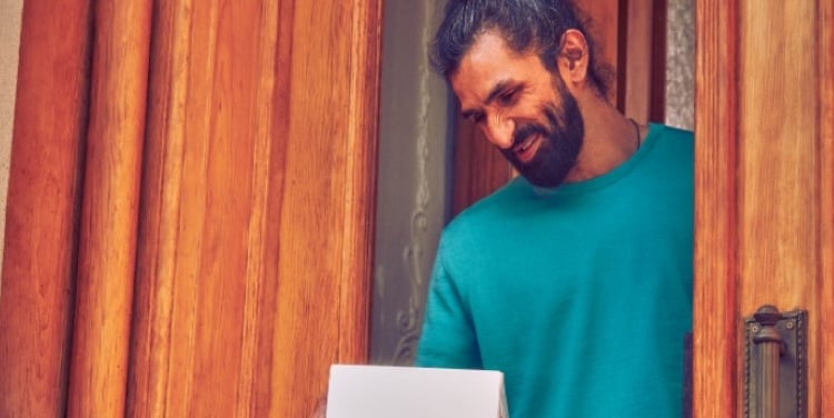 A man with an IQOS box.
