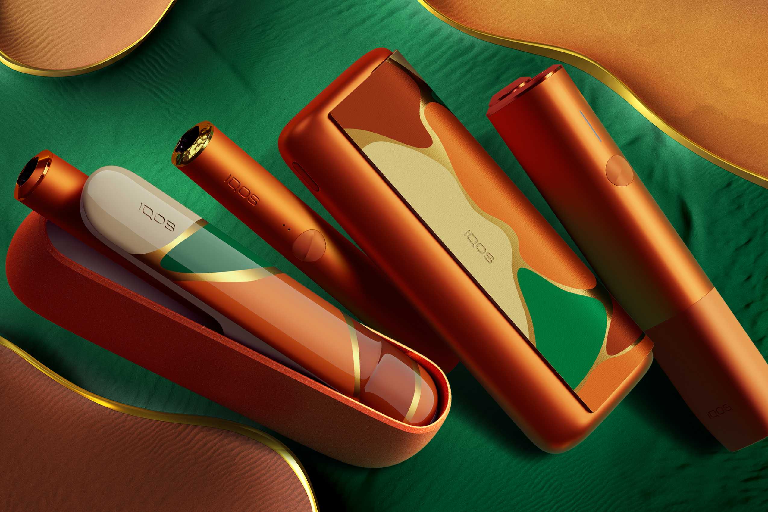Nuevo IQOS ILUMA OASIS Edición Limitada: 3 dispositivos para calentar tabaco sobre fondo dorado y verde
