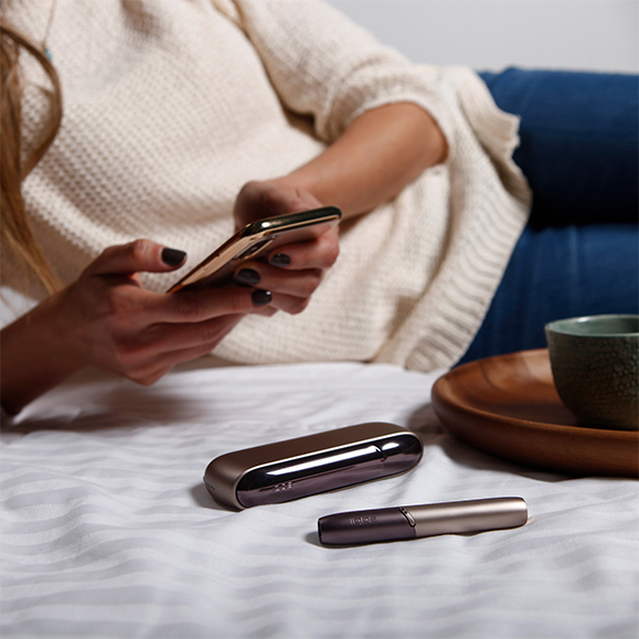 Girl With IQOS and mobile