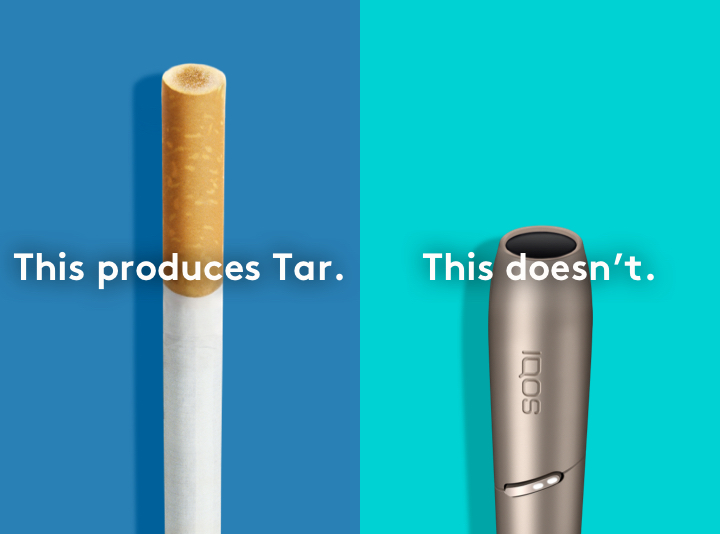 Cigarette filter with brown combustion stains next to IQOS 3 DUO holder