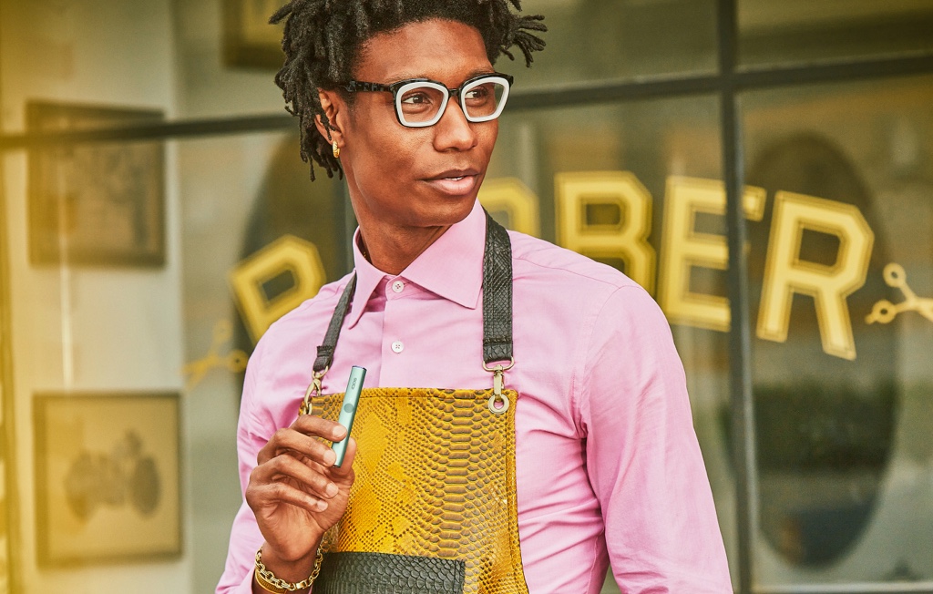 A man with an IQOS ILUMA device.
